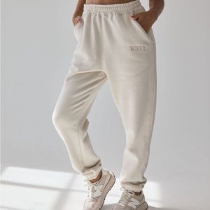 Cream Track Pants with Elastic Waistband and Tapered Legs